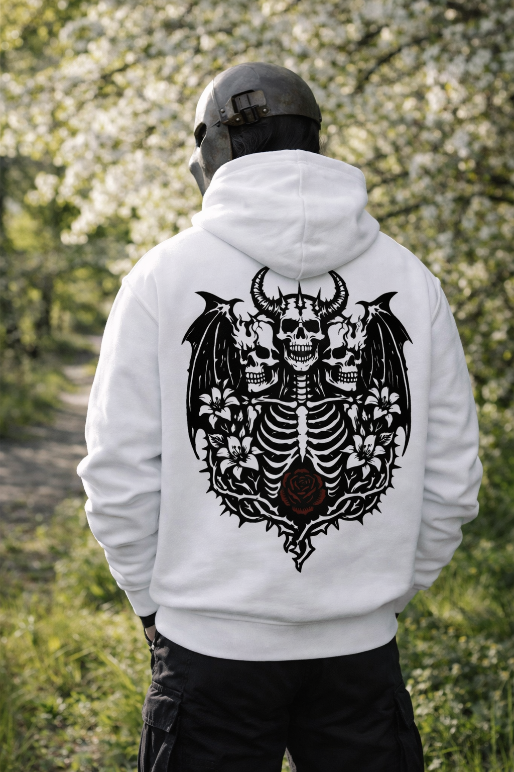 Original JayStan skull and flower artwork on the back of a white hoodie